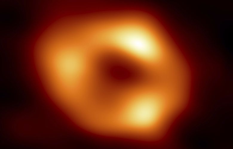 This image released by the Event Horizon Telescope Collaboration, Thursday, May 12, 2022, shows a black hole at the center of our Milky Way galaxy. The Milky Way black hole is called Sagittarius A*, near the border of Sagittarius and Scorpius constellations. It is 4 million times more massive than our sun. The image was made by eight synchronized radio telescopes around the world. (Event Horizon Telescope Collaboration via AP) WX301 WX301