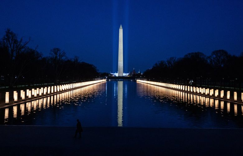 FILE – The National COVID-19 Memorial on the Mall in Washington on Jan. 19, 2021, when the United States marked 400,000 deaths from the coronavirus. President Joe Biden, anticipating the milestone of one million American lives lost to COZVID-19, said in a formal statement on Thursday, May 12, 2022, that the United States must stay committed to fighting a virus that has “forever changed” the country. (Todd Heisler/The New York Times)