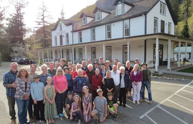 NOW3: Owners of the Bush House Inn — (at left) the six-member Corson family as well as (next to them) Dan Kerlee (green shirt) and wife Carol Wollenberg (pink sweater) — join Index volunteers and the visiting Millers of West Seattle’s Husky Deli in late April in front of the hotel. Third from right in the front row, matriarch Marie Miller was celebrating her 93rd birthday. Credit: Clay Eals