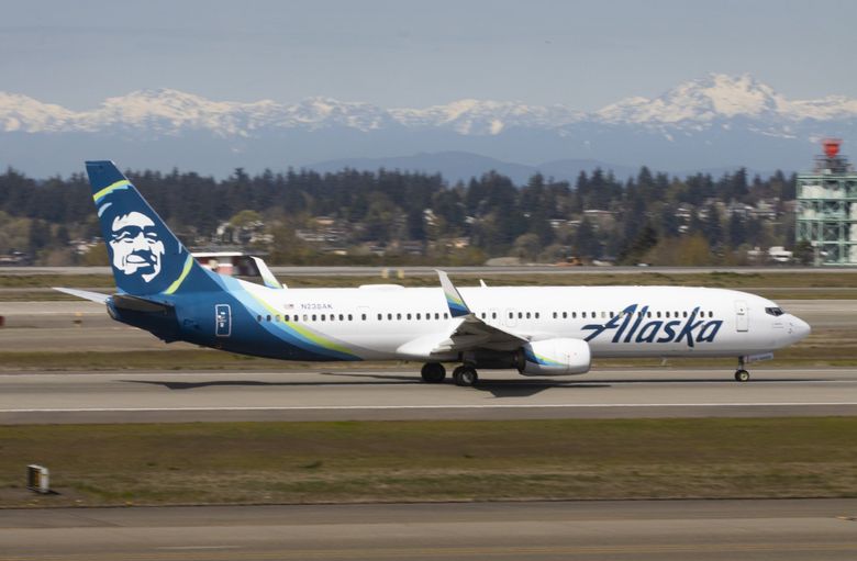 An Alaska Airlines jet takes off at Seattle-Tacoma International Airport in April.  A shortage of pilots caused a spate of flight cancellations that month that has continued since and caused travel chaos for many Alaska passengers. (Ellen M. Banner / The Seattle TImes)