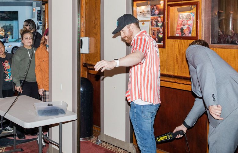 Garrett Baney is searched as he enters the Laugh Factory in Los Angeles, May 10, 2022. After Will Smith slapped Chris Rock onstage at the Oscars and Dave Chappelle was tackled at the Hollywood Bowl, some venues are increasing security to protect comedians. (Alex Welsh/The New York Times) XNYT57 XNYT57