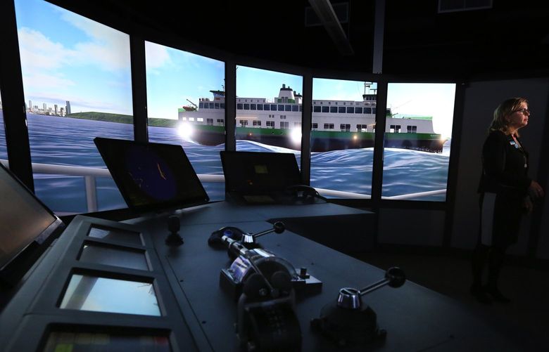 During a tour of the Seattle Maritime Academy, Director and Associate Dean Sarah Scherer takes questions from the media in the ferry wheelhouse simulator on Thursday
Oct. 6, 2016.  The room does not move but the projections of Puget Sound do and give the feeling of being on the water.

ref to more online including more photos and raw video

The facility is to train current and future maritime workers.

LO Linesonly