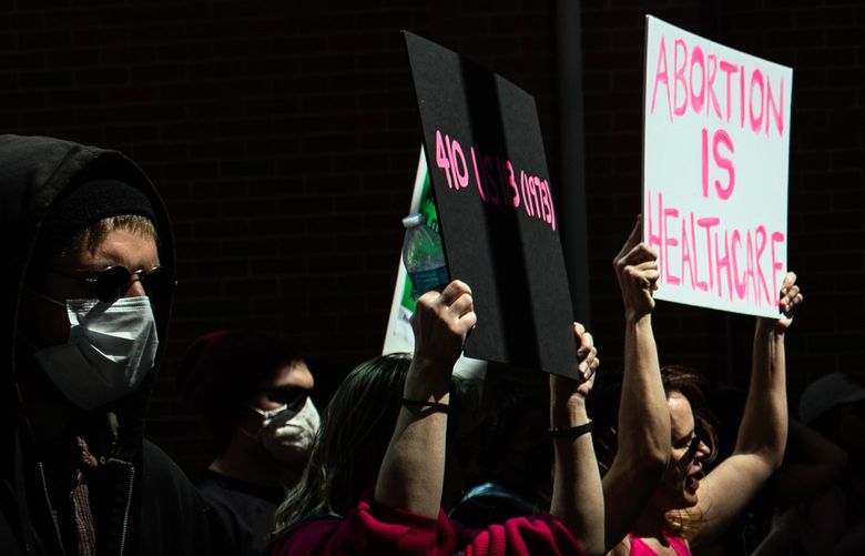 Abortion rights supporters march through downtown Detroit on May 7, 2022, days after the Supreme Court draft opinion was leaked. The Republican Party was making headway with suburban women on crime, schools and inflation. Now the abortion debate is front and center. (Emily Elconin/The New York Times)