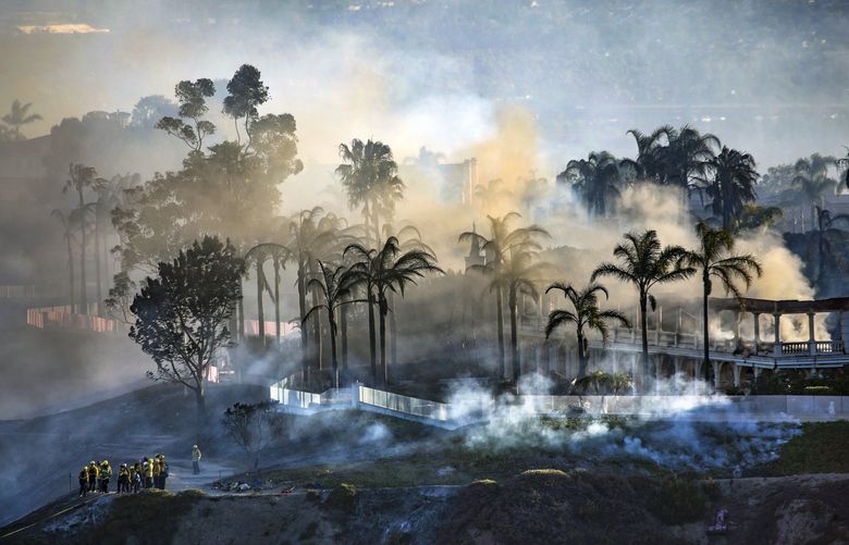 A view of homes still smoldering from the Coastal fire as seen from Talavera Drive on Thursday, May 12, 2022 in Laguna Niguel, California. (Irfan Khan/Los Angeles Times/TNS) 47711908W 47711908W