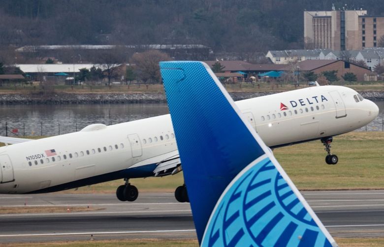 A Delta Airlines plane takes off at Reagan National Airport in Arlington, Virginia, U.S., on Friday, Dec. 24, 2021. Photographer: Eric Lee/Bloomberg
