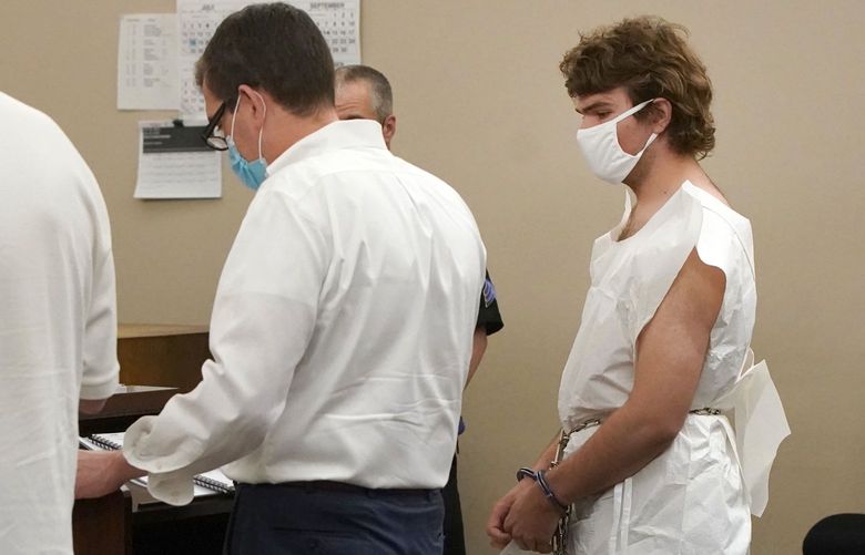 Payton Gendron talks with his attorney during his arraignment in Buffalo City Court, Saturday, May 14, 2022, in Buffalo, N.Y. Gendron was arraigned on first-degree murder charges and ordered detained without bail. Police officials said the 18-year-old was wearing body armor and military-style clothing when he pulled up and opened fire at people at a Tops Friendly Market. (Mark Mulville/The Buffalo News via AP) NYBUE107 NYBUE107