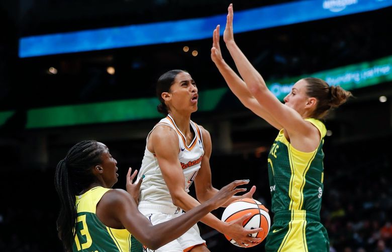 Climate Pledge Arena – Seattle Storm vs. Phoenix Mercury – 051422
Phoenix Mercury guard Skylar Diggins-Smith elevates between Seattle Storm center Ezi Magbegor, left, and forward Stephanie Talbot for two points during the first quarter May 14, 2022, in Seattle, Wash. 220353