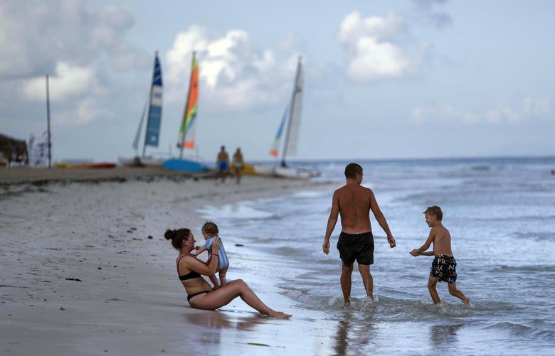 FILE – Tourists are seen along the beach at the Iberostar Selection Varadero hotel in Varadero, Cuba, on Sept. 29, 2021. The Biden administration announced Monday that it will expand flights to Cuba and lift Donald Trump-era restrictions on remittances that immigrants can send to people on the island. (AP Photo/Ramon Espinosa, File) WX122 WX122
