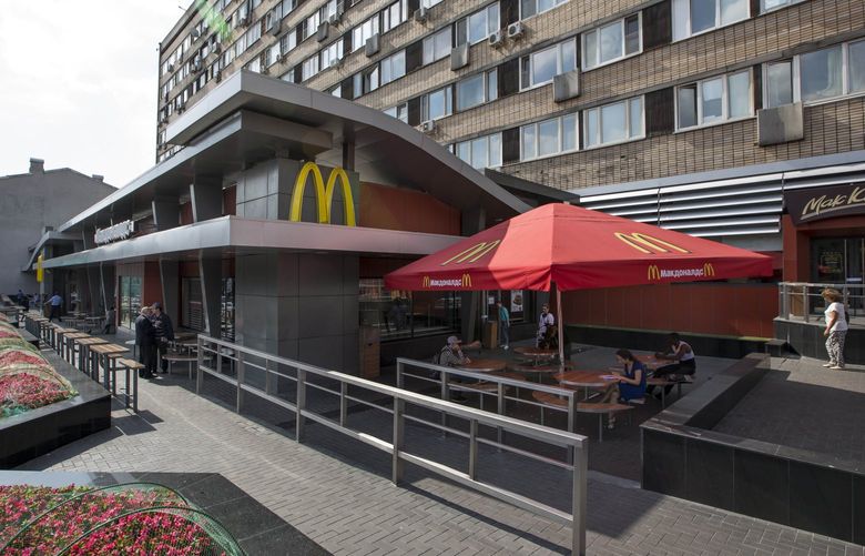 FILE – The oldest of Moscow’s McDonald’s outlets, which was opened on Jan. 31, 1990, is closed on Aug. 21, 2014. McDonald’s says it’s started the process of selling its Russian business, which includes 850 restaurants that employ 62,000 people. The fast food giant pointed to the humanitarian crisis caused by the war, saying holding on to its business in Russia “is no longer tenable, nor is it consistent with McDonald’s values.†The Chicago-based company had temporarily closed its stores in Russia but was still paying employees. (AP Photo/FILE) ALP101 ALP101