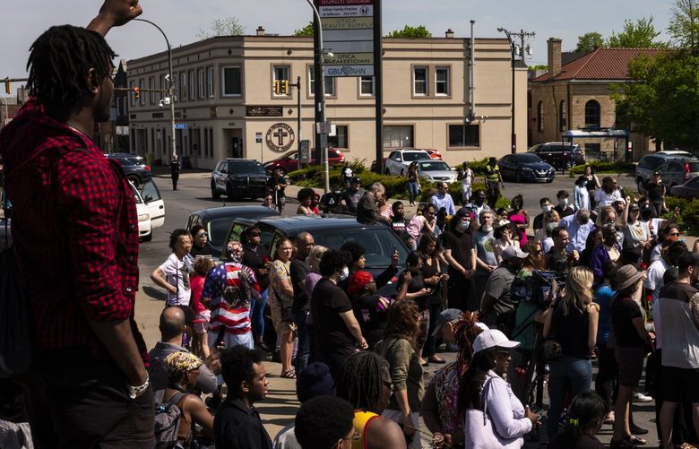 Community members, religious leaders and activists march through a neighborhood on Sunday near the Tops supermarket in Buffalo, N.Y., where 10 people were killed a day earlier, May 15, 2022. Replacement theory, espoused by the suspect in the Buffalo massacre, has been embraced by some right-wing politicians and commentators. (Joshua Rashaad McFadden/The New York Times) XNYT155 XNYT155