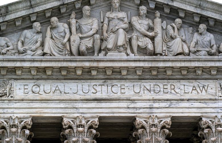 The Supreme Court Building is seen in Washington, Wednesday, May 4, 2022, as security measure are enhanced on the perimeter following protests sparked by news that the court might overturn cases that guarantee abortions. More demonstrations are expected in the wake of a Politico story about Supreme Court Justice Samuel Alito’s draft majority opinion, which sets the stage for the court to overturn Roe v. Wade and Planned Parenthood v. Casey. (AP Photo/J. Scott Applewhite) DCSA121 DCSA121