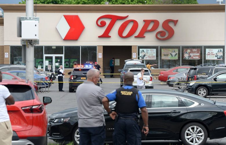 Police on scene at a Tops Friendly Market on Saturday, May 14, 2022, in Buffalo, New York. According to reports, at least 10 people were killed after a mass shooting at the store, with the shooter in police custody. (John Normile/Getty Images/TNS) 48002525W 48002525W