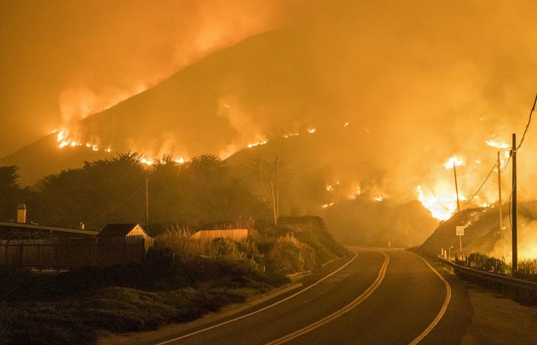 The Colorado Fire burns along Highway 1 near Big Sur, Calif., Saturday, Jan. 22, 2022. (AP Photo/Nic Coury) CANC106