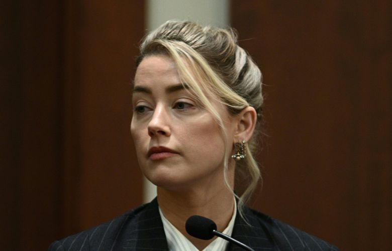 Actor Amber Heard testifies in the courtroom at the Fairfax County Circuit Courthouse in Fairfax, Va., Tuesday, May 17, 2022.  Actor Johnny Depp sued his ex-wife Amber Heard for libel in Fairfax County Circuit Court after she wrote an op-ed piece in The Washington Post in 2018 referring to herself as a “public figure representing domestic abuse.” (Brendan Smialowski/Pool photo via AP) WX309 WX309