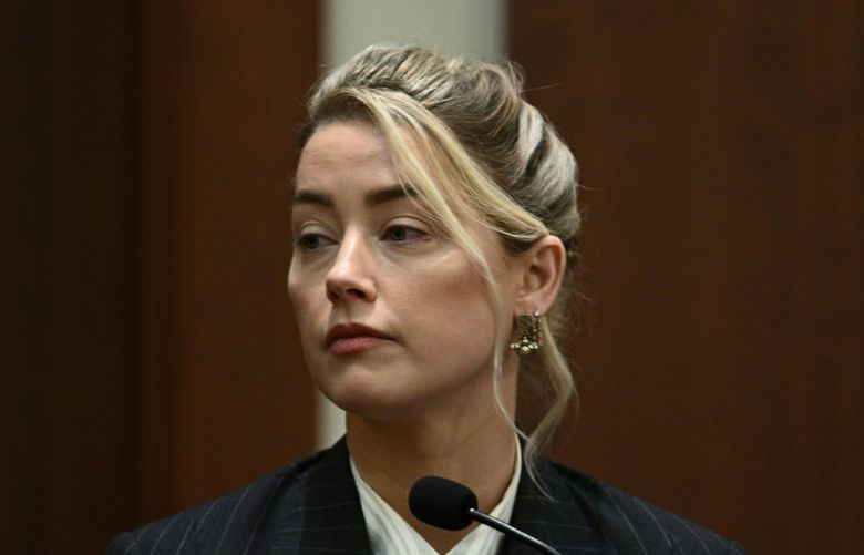 Actor Amber Heard testifies in the courtroom at the Fairfax County Circuit Courthouse in Fairfax, Va., Tuesday, May 17, 2022. Actor Johnny Depp sued his ex-wife Amber Heard for libel in Fairfax County Circuit Court after she wrote an op-ed piece in The Washington Post in 2018 referring to herself as a “public figure representing domestic abuse.” (Brendan Smialowski/Pool photo via AP) WX309 WX309