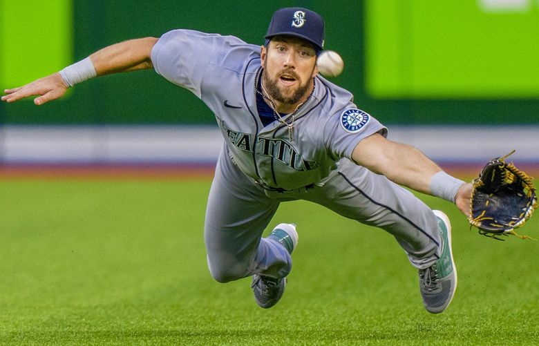 Seattle Mariners right fielder Steven Souza Jr. dives to try to catch a ball hit by Toronto Blue Jays’ George Springer for a three-run triple during the second inning of a baseball game Tuesday, May 17, 2022, in Toronto. (Frank Gunn/The Canadian Press via AP) FNG102