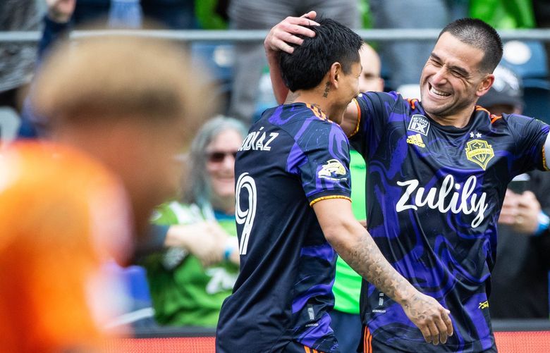 Nicolas Lodeiro celebrates his goal in the 94th minute against Minnesota, beating goalkeeper Dayne St. Clair (foreground).

Minnesota United FC played the Seattle Sounders in MLS action Sunday, May 15, 2022 from Lumen Field in Seattle, WA. 220388