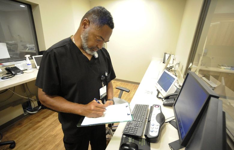 Radiology manager Marshall C. Pritchett Jr. works on a file at Thomasville Regional Medical Center in Thomasville, Ala., on Tuesday, May 3, 2022. The hospital is among three in the nation that say they are missing out on federal pandemic relief money because they opened during or shortly before the COVID-19 crisis began. (AP Photo/Jay Reeves) ALJR103 ALJR103