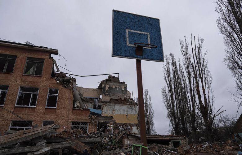 FILE – A basketball hoop and backboard stands amid the damage at a school after an airstrike by Russian forces in Chernihiv, Ukraine, Wednesday, April 13, 2022. Targeting schools and other civilian infrastructure is a war crime. Experts say wide-scale wreckage can be used as evidence of Russian intent, and to refute claims that schools were simply collateral damage. (AP Photo/Evgeniy Maloletka, File) NY732 NY732