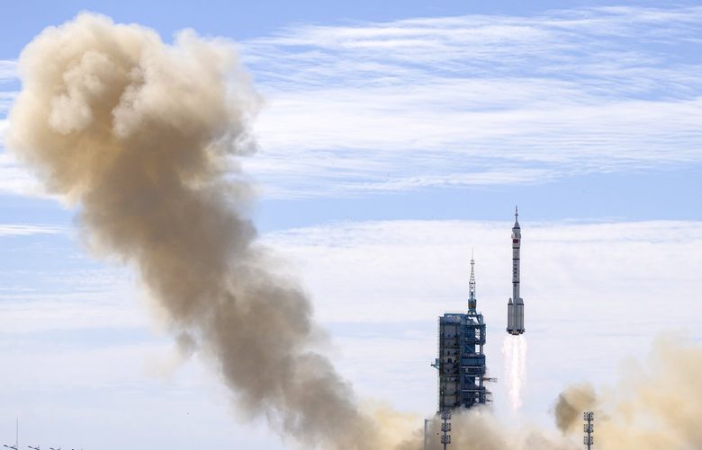 A Long March-2F Y12 rocket carrying a crew of Chinese astronauts in a Shenzhou-12 spaceship lifts off at the Jiuquan Satellite Launch Center in Jiuquan in northwestern China, Thursday, June 17, 2021. China has launched the first three-man crew to its new space station in its the ambitious programs first crewed mission in five years. (AP Photo/Ng Han Guan) XHG116