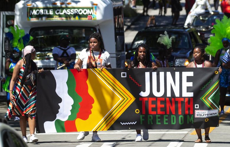 at the Juneteenth Freedom March and Festival along 23rd Avenue East in Seattleâ€™s Central District neighborhood Saturday June 19, 2021. Juneteenth, recently recognized as a federal holiday, commemorates the day in 1865 that Union troops arrived in Galveston, Texas, to command freedom for all enslaved people, more than two years after the Emancipation Proclamation. It celebrates the end of slavery in the United States.