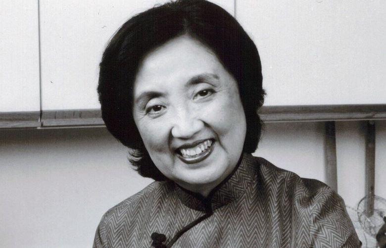 Joyce Chen in the kitchen with her branded products – a flat-bottom wok, knife and sauces – in 1984.