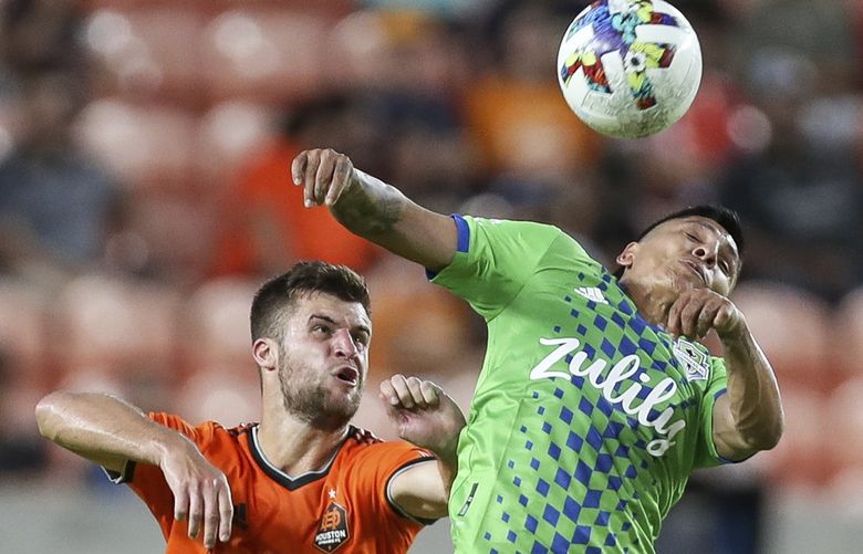 Seattle Sounders forward RaÃºl RuidÃ­az (9) uses his shulder to control the ball against Houston Dynamo defender Ethan Bartlow (13) during the first half of an MLS soccer match Wednesday, May 18, 2022, in Houston. (Godofredo A. VÃ(degrees)squez/Houston Chronicle via AP) TXHOU321 TXHOU321