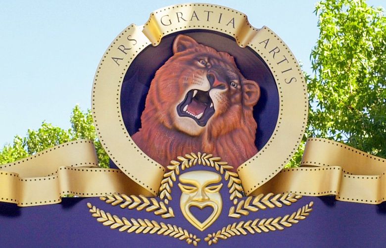 FILE – In this July 23, 2002 file photo, the Metro-Goldwyn-Mayer logo graces the entrance gates company’s former location in Santa Monica, Calif. MGM Inc. is preparing to receive binding acquisition offers Friday, March 18, 2010, as it again looks for a corporate savior for its troubles. (AP Photo/Nick Ut, File) NYBZ136