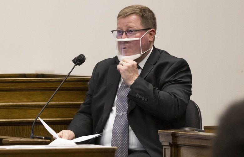 Seattle Police Department homicide detective Don Witmer answers questions on the witness stand regarding a fatal shooting in the Westlake station transit tunnel in King County Superior Court Judge Janet Helson’s courtroom  Wednesday, May 4, 2022.   220293