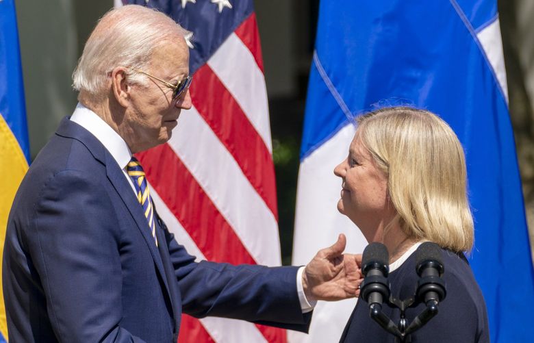 President Joe Biden, accompanied by Finnish President Sauli Niinisto, right, hugs Swedish Prime Minister Magdalena, center, after she speaks during an event in the Rose Garden of the White House in Washington, Thursday, May 19, 2022. (AP Photo/Andrew Harnik) DCAH202 DCAH202