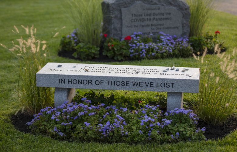 FILE – An inscribed bench at a coronavirus memorial in the Baker Street Jewish Cemeteries in Boston, Sept. 16, 2020. The United States officially surpassed one million known deaths from COVID-19 on Thursday, May 19, 2022, according to a New York Times tally, a cataclysmic outcome that only hints at the suffering of millions more Americans who are mourning their parents, children, siblings, friends and colleagues. (M. Scott Brauer/The New York Times) XNYT261 XNYT261 (M. SCOTT BRAUER / NYT)