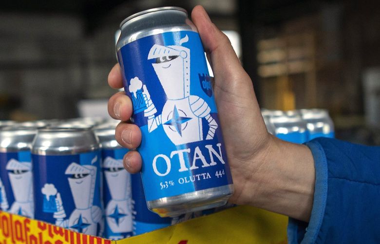 Beer cans with writing OTAN inspired by the North Atlantic Treaty Organization (NATO) logo by Olaf Brewing Company are displayed in Savonlinna, eastern Finland, Tuesday, May 17, 2022. Sweden on Tuesday signed a formal request to join NATO, a day after the country announced it would seek membership in the 30-member military alliance. In neighboring Finland, lawmakers are expected later in the day to formally endorse Finnish leaders’ decision also to join. The moves by the two Nordic countries, ending Sweden’s more than 200 years of military nonalignment and Finland’s nonalignment after World War II, have provoked the ire of the Kremlin. (Soila Puurtinen/Lehtikuva via AP) LBL817 LBL817