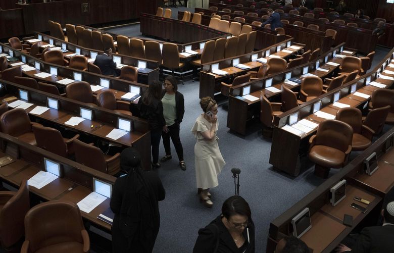 Former coalition lawmaker Idit Silman speaks on her phone during the opening of the summer session of the Knesset, Israel’s parliament, in Jerusalem, Monday, May 9, 2022.Less than a year after taking office, Naftali Bennett has lost his parliamentary majority, his own party is crumbling and a key governing partner has suspended cooperation with the coalition. That has set the stage for a possible attempt by the opposition, led by former Prime Minister Benjamin Netanyahu, to topple the government later this week. (AP Photo/Maya Alleruzzo) XMA106 XMA106