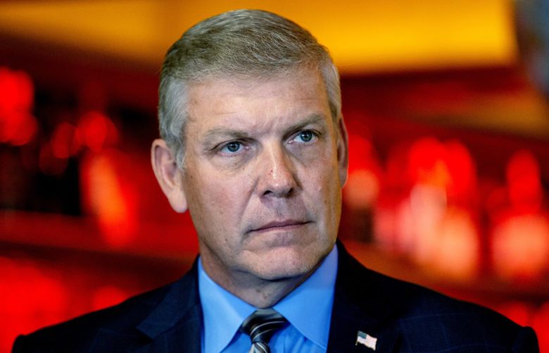 FILE – Rep. Barry Loudermilk, R-Georgia, listens to a speaker at a press conference, May 4, 2021, in Marietta, Ga. Loudermilk of Georgia is the latest GOP lawmaker to be asked to cooperate with the House select committee probing the violence that took place on Jan. 6, 2021. (AP Photo/Ron Harris, File) WX103 WX103