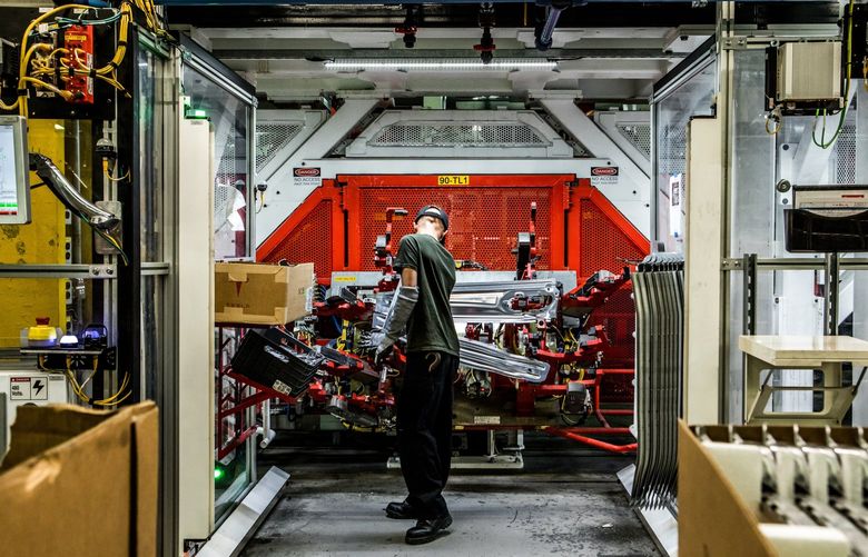 FILE – Inside an assembly factory the electric automaker Tesla in Fremont, Calif., June 14, 2018. Tesla chief Elon Musk called the S&P 500 ESG Index, a prominent index of socially responsible companies, a “scam” after it dropped Tesla because of the way the carmaker handled accusations of racial discrimination at its factory in California. (Christie Hemm Klok/The New York Times) XNYT163 XNYT163