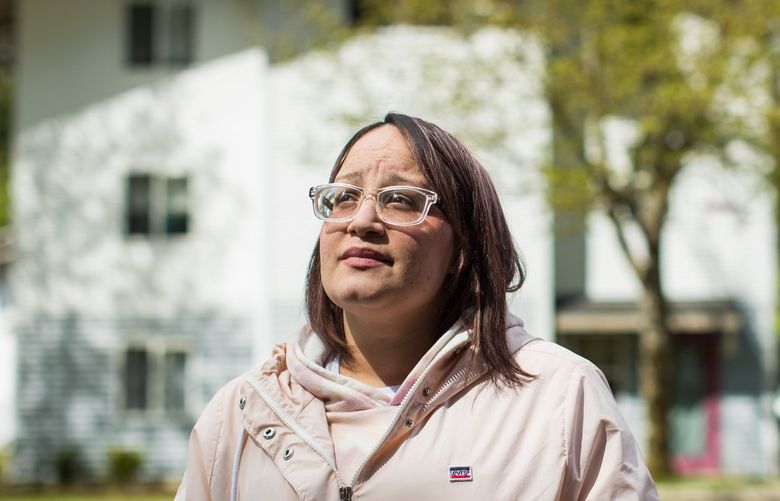 For story about landlords smacking tenants with super high damage claims: Natasha Pabon photographed outside her former apartment building in Olympia, WA, May 10, 2022. (Photo by Dan DeLong)
