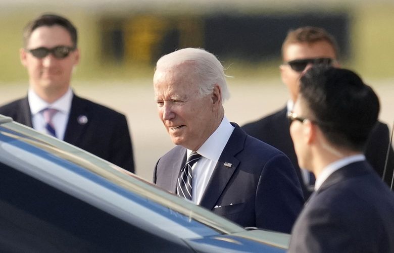 U.S. President Joe Biden, center left, arrives at Osan Air Base in Pyeongtaek, South Korea, Friday, May 20, 2022. (AP Photo/Lee Jin-man, Pool) TKSJ510 TKSJ510