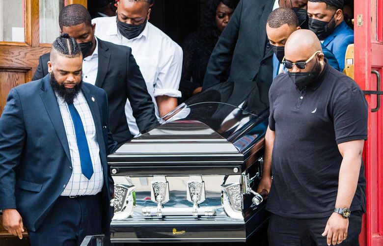 The coffin bearing the remains of Heyward Patterson, who was killed on May 14 in the racist shooting at a Tops Friendly Market, is carried from the Lincoln Memorial United Methodist Church in Buffalo, N.Y., on Friday May 20, 2022. Patterson, a 67-year-old church deacon whose life revolved around service and faith, was the first of 10 massacre victims to be laid to rest on Friday. (Gabriela Bhaskar/The New York Times) XNYT214