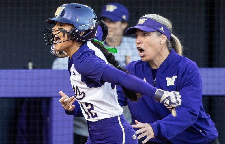 Coach Heather Tarr sends Jadelyn Allchin home after her 3-run blast opened up the game for Washington in the 5th.

The 13th-seeded Washington Huskies played the Lehigh University Mountain Hawks in NCAA Regional Softball Friday, May 20, 2022 at Husky Softball Stadium, in Seattle, WA. 220420