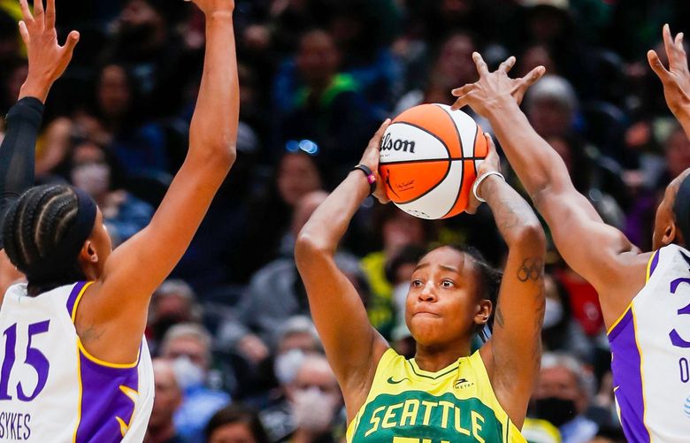 Climate Pledge Arena – Seattle Storm vs. Los Angeles Sparks – 052022
Seattle Storm guard Jewell Loyd passes between Los Angeles Sparks guard Brittney Sykes and forward Nneka Ogwumike during the second quarter Friday, May 20, 2022, in Seattle, Wash.