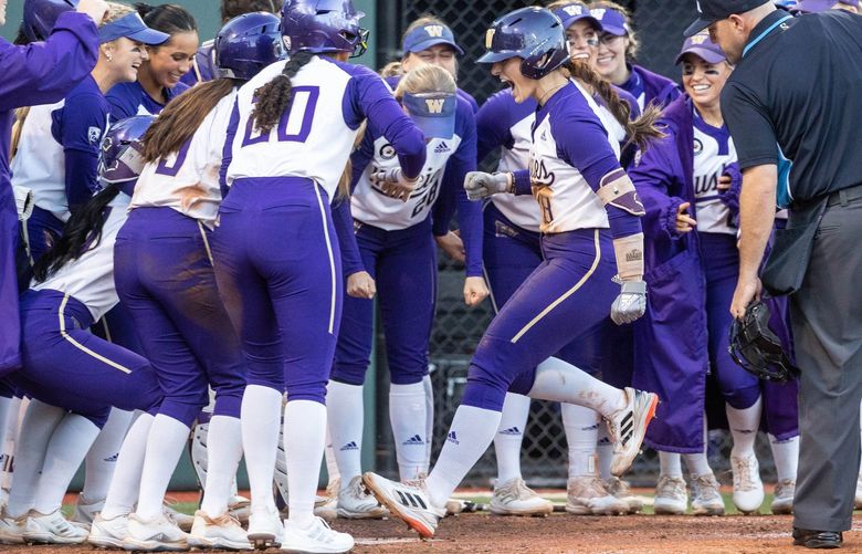 The umpire checks to make sure Baylee Klingler touches home following her 3-run blast in the 6th.

The 13th-seeded Washington Huskies played the Lehigh University Mountain Hawks in NCAA Regional Softball Friday, May 20, 2022 at Husky Softball Stadium, in Seattle, WA. 220420