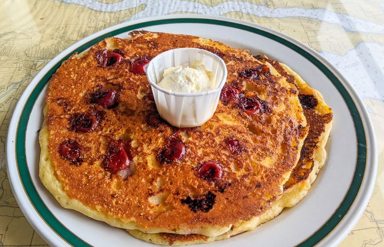 Any visit to Point Hudson Cafe in Port Townsend should begin with an order of the crunchy, sweet cherry cornmeal pancakes for the table.