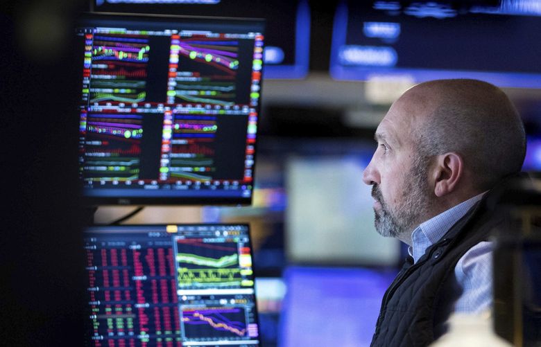 In this photo provided by the New York Stock Exchange, specialist James Denaro works at his post on the floor, Friday, May 20, 2022. Another drop for stocks on Friday has pushed the S&P 500 index 20% below its peak set early this year. (Allie Joseph/New York Stock Exchange via AP) NYRD509 NYRD509