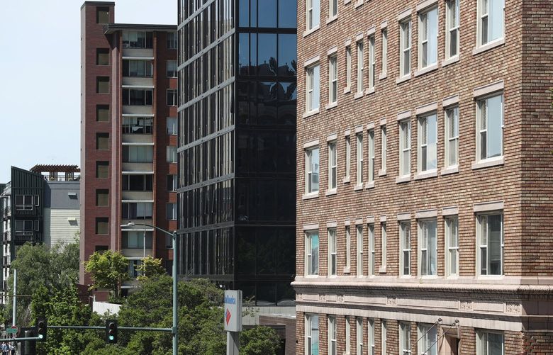 Older and newer apartments are side-by-side west of the University of Washington, Sunday, May 22, 2022 in Seattle. This goes with an FYI Guy column about three census tracts with the largest income gaps.