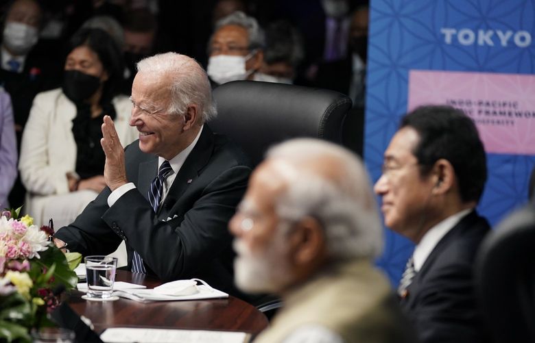 U.S. President Joe Biden, left, waves during the Indo-Pacific Economic Framework for Prosperity launch event with Japanese Prime Minister Fumio Kishida and Indian Prime Minister Narendra Modi at the Izumi Garden Gallery, Monday, May 23, 2022, in Tokyo. (AP Photo/Evan Vucci) JPKS163 JPKS163