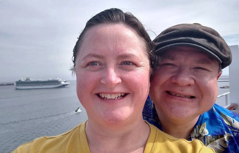 Husband and wife Angelyn and Richard Burk aboard a Carnival Cruise Line ship in March 2022. The couple has decided to spend their retirement on cruise ships. (Family photo)