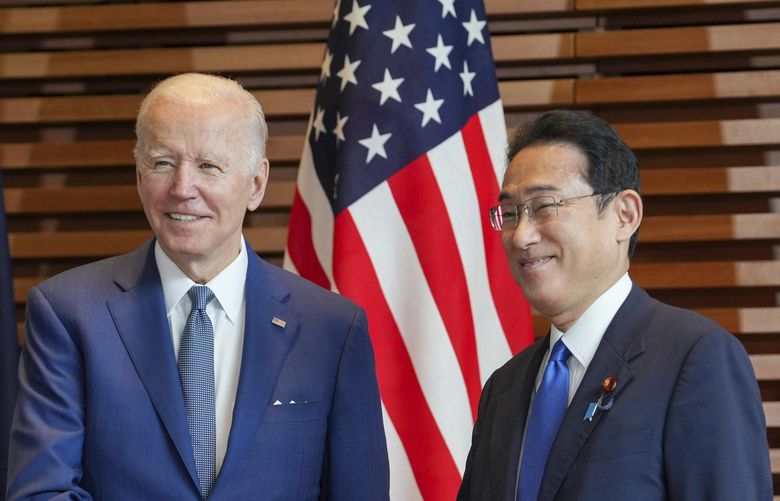 U.S. President Joe Biden, left, is welcomed by Japan’s Prime Minister Fumio Kishida, at the entrance hall of the Prime Minister’s Office of Japan in Tokyo, Japan, Tuesday, May 24, 2022. Leaders of the U.S., Japan, Australia and India gathered in Tokyo on Tuesday for a summit of the “Quad.†(Zhang Xiaoyu/Pool Photo via AP) TKSJ305 TKSJ305
