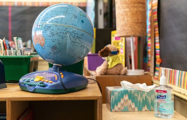 A bottle of hand sanitizer sits next to a globe in a classroom at New Bridges Elementary School in the Brooklyn borough of New York last August. In May 2022, the U.S. Supreme Court turned away a challenge to New York’s requirement that schoolchildren be vaccinated against serious diseases, with no exemption for religious objections.
