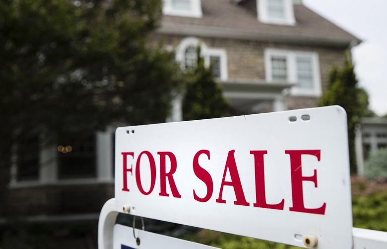 FILE- In this June 8, 2018, file photo a for sale sign stands in front of a house, in Pennsylvania. (AP Photo/Matt Rourke, File) 