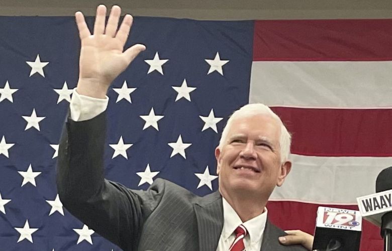 U.S. Rep. Mo Brooks, left, waves during a campaign appearance with Sen. Ted Cruz of Texas in Huntsville, Ala., on Monday, May 23, 2022. Brooks is among the candidates seeking the Republican nomination for the seat held by Alabama Sen. Richard Shelby, who is retiring. (AP Photo/Kim Chandler) GAMS901 GAMS901